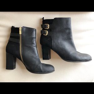 Leather and suede black booties with gold buckle